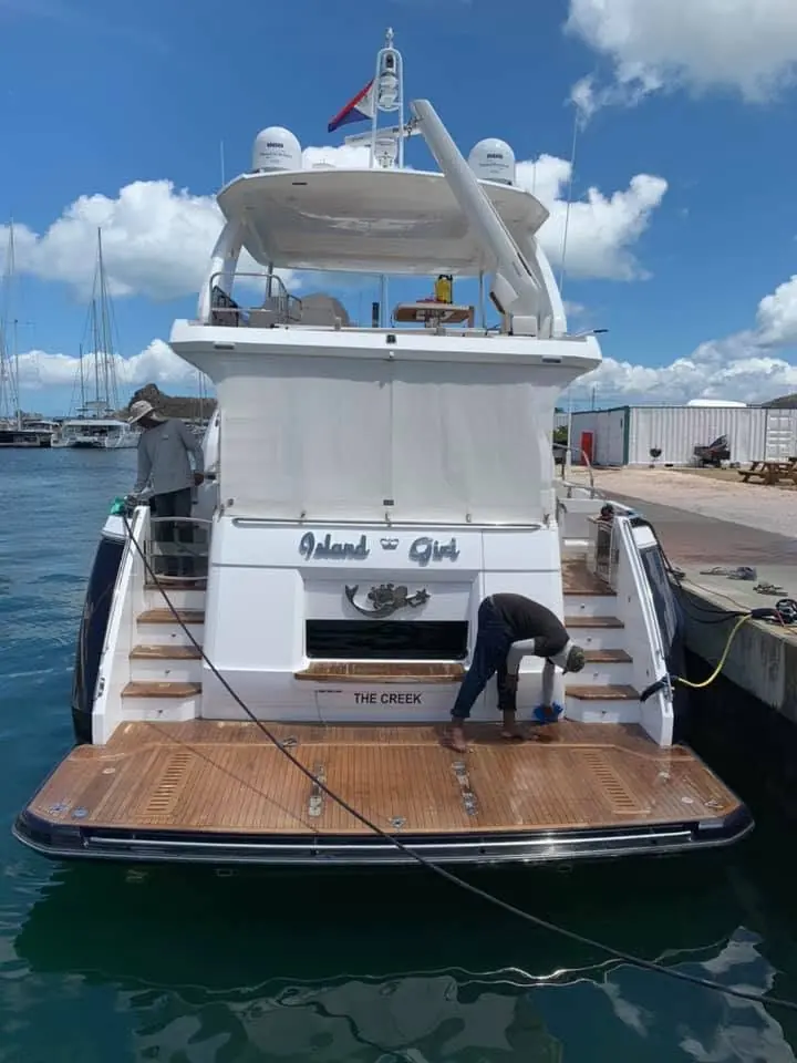 Motor yacht Island Girl being detailed at the dock by SXM Refinishing in St. Maarten